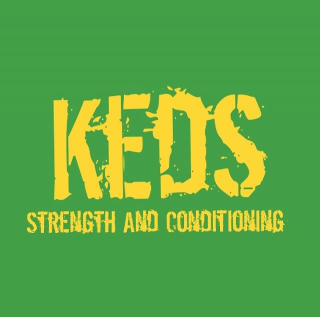 Keds logo greeen backgruond yellow text