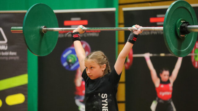 Youth female lifter lifting in competition